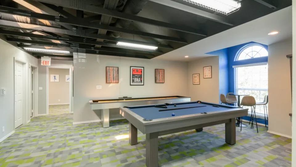 a pool table in a game room with a blue ceiling at The Hickory Highlands