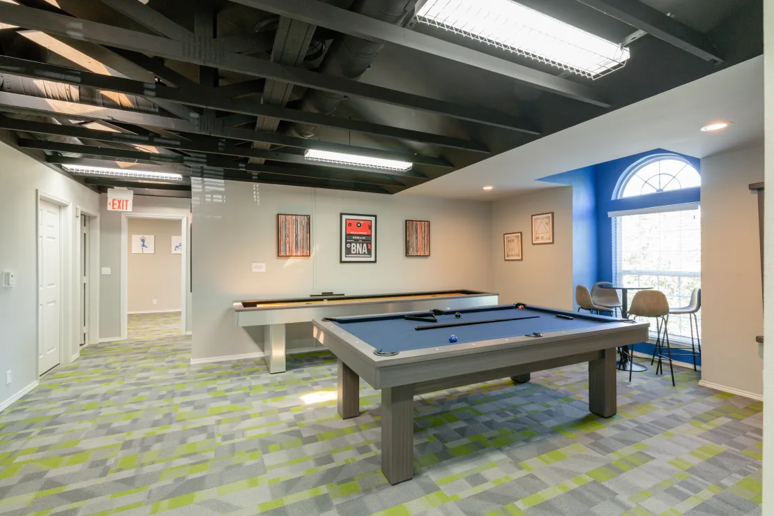 a pool table in a game room with a blue ceiling at The Hickory Highlands